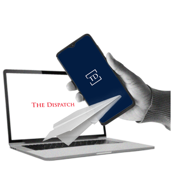 A hand holds a smartphone displaying a 